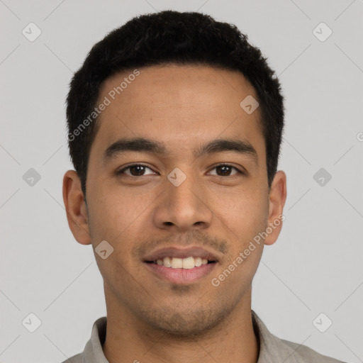 Joyful latino young-adult male with short  black hair and brown eyes