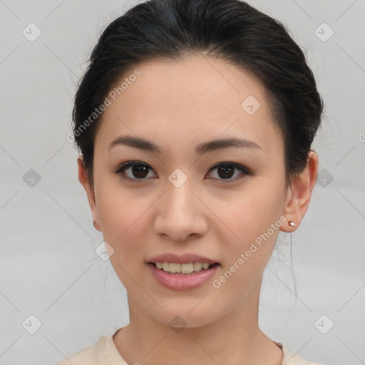 Joyful asian young-adult female with short  brown hair and brown eyes