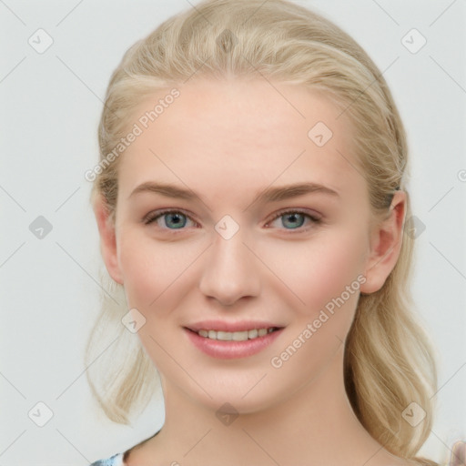 Joyful white young-adult female with long  brown hair and blue eyes