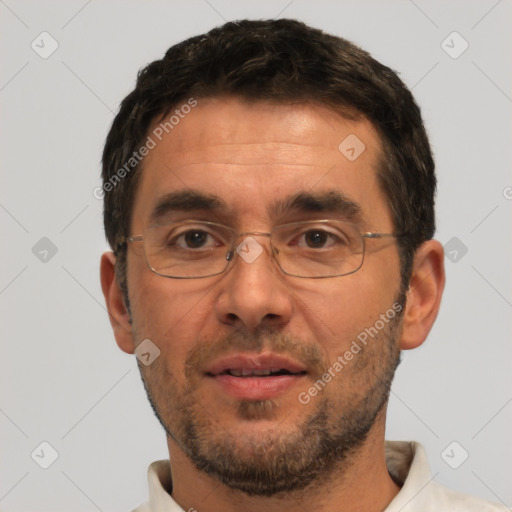 Neutral white adult male with short  black hair and brown eyes