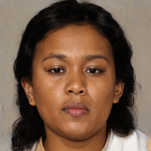 Neutral black young-adult female with medium  brown hair and brown eyes
