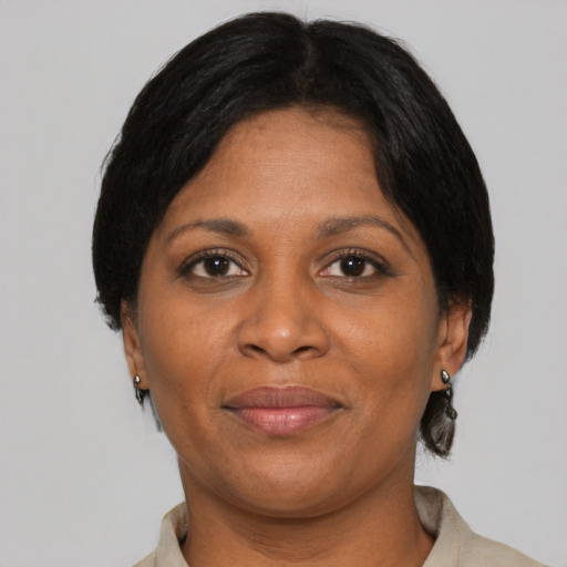 Joyful asian adult female with medium  brown hair and brown eyes