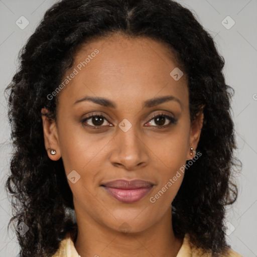 Joyful black young-adult female with long  brown hair and brown eyes