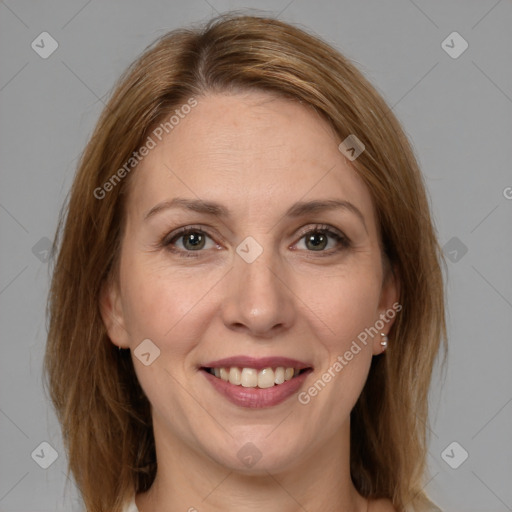 Joyful white adult female with medium  brown hair and grey eyes