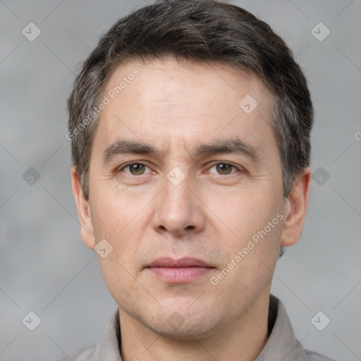 Neutral white adult male with short  brown hair and grey eyes