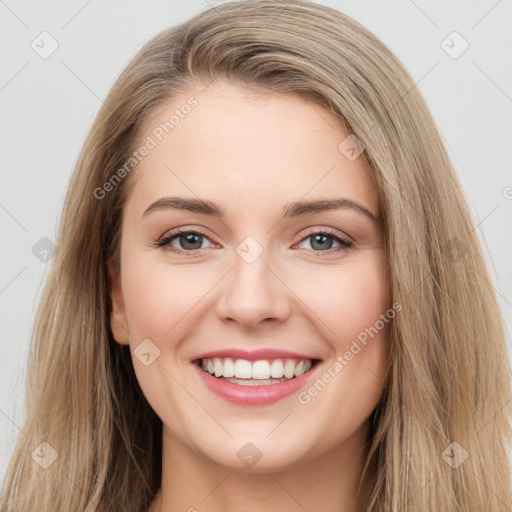 Joyful white young-adult female with long  brown hair and grey eyes