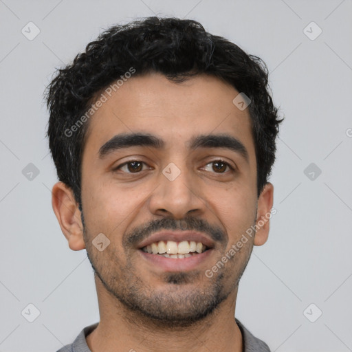 Joyful latino young-adult male with short  black hair and brown eyes