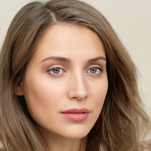 Neutral white young-adult female with long  brown hair and green eyes