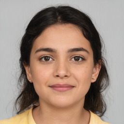 Joyful white young-adult female with medium  brown hair and brown eyes