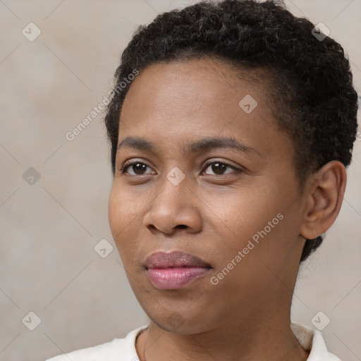 Joyful black young-adult female with short  black hair and brown eyes