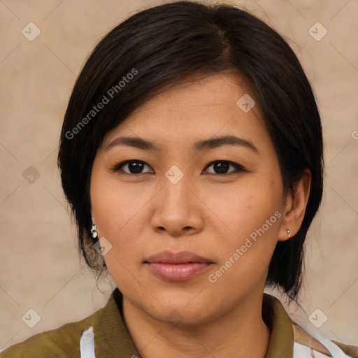 Joyful asian young-adult female with medium  brown hair and brown eyes