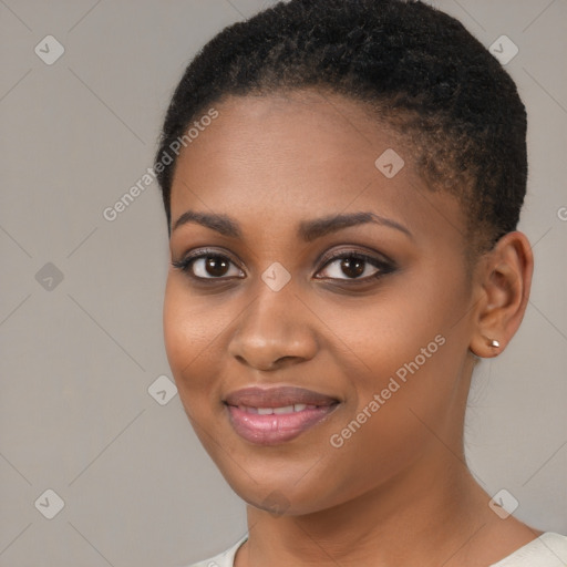 Joyful black young-adult female with short  brown hair and brown eyes