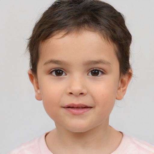 Joyful white child male with short  brown hair and brown eyes