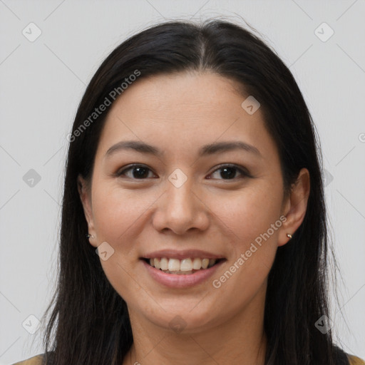 Joyful asian young-adult female with long  brown hair and brown eyes