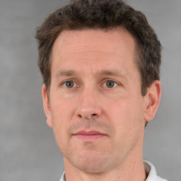 Neutral white adult male with short  brown hair and brown eyes