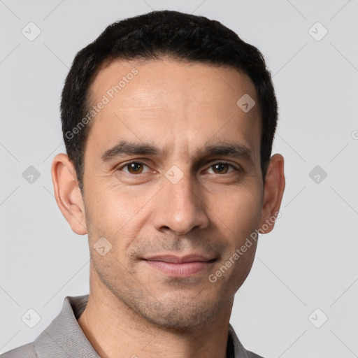 Joyful white young-adult male with short  black hair and brown eyes