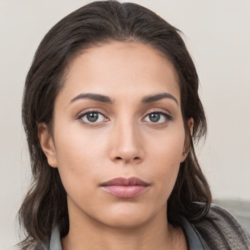 Neutral white young-adult female with medium  brown hair and brown eyes