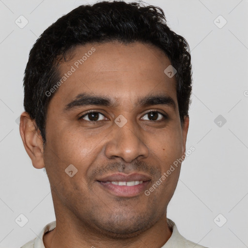 Joyful latino young-adult male with short  brown hair and brown eyes