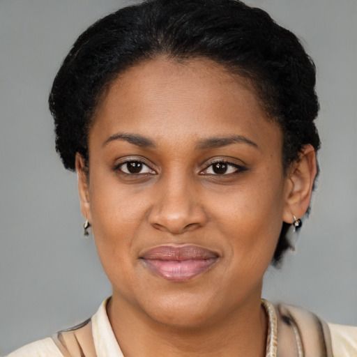 Joyful latino adult female with short  brown hair and brown eyes