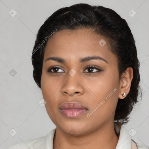 Joyful black young-adult female with medium  black hair and brown eyes