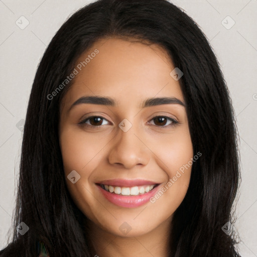 Joyful latino young-adult female with long  black hair and brown eyes