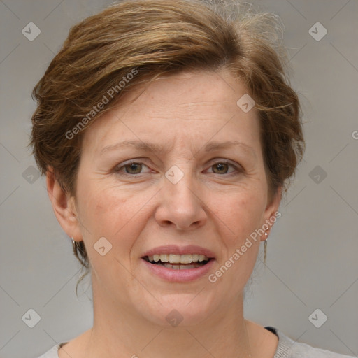 Joyful white adult female with short  brown hair and grey eyes