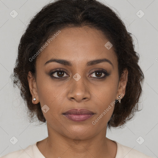 Joyful black young-adult female with long  brown hair and brown eyes