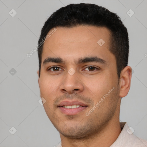 Joyful white young-adult male with short  black hair and brown eyes