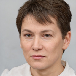 Joyful white adult female with short  brown hair and brown eyes