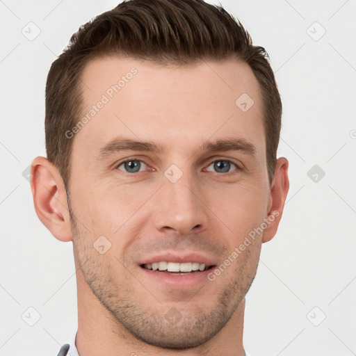 Joyful white young-adult male with short  brown hair and grey eyes