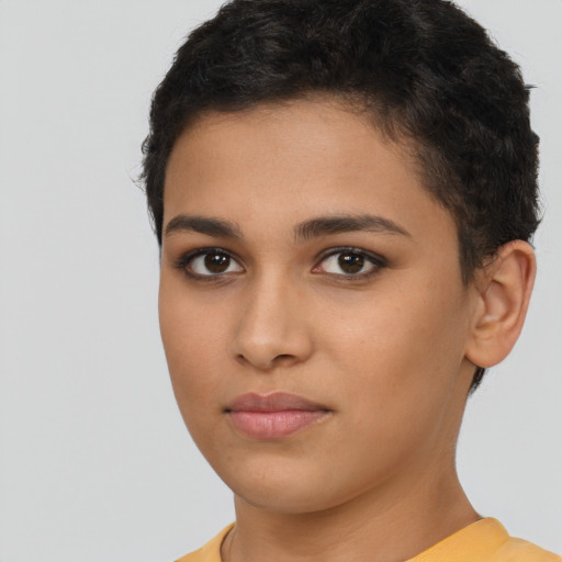 Joyful latino young-adult female with short  brown hair and brown eyes