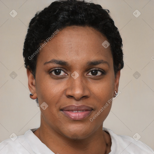 Joyful black young-adult female with short  black hair and brown eyes