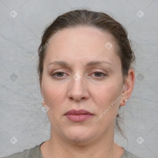 Joyful white adult female with short  brown hair and grey eyes