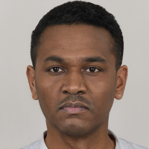 Neutral black young-adult male with short  black hair and brown eyes