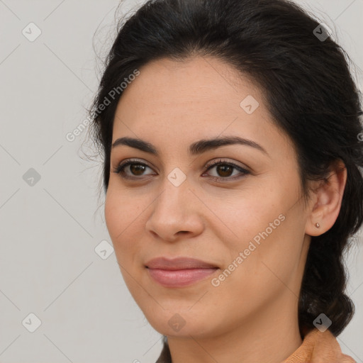 Joyful latino young-adult female with medium  brown hair and brown eyes