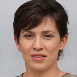 Joyful white adult female with short  brown hair and brown eyes