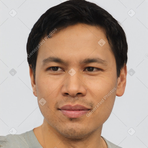 Joyful asian young-adult male with short  black hair and brown eyes