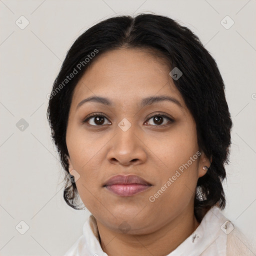Joyful latino young-adult female with medium  brown hair and brown eyes