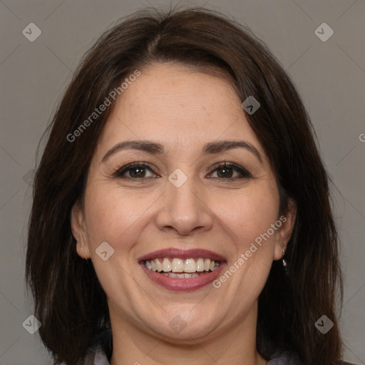 Joyful white adult female with medium  brown hair and brown eyes