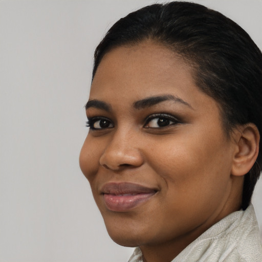 Joyful latino young-adult female with short  brown hair and brown eyes