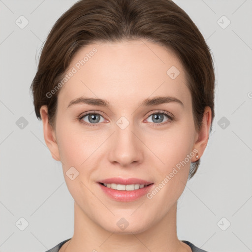 Joyful white young-adult female with short  brown hair and grey eyes