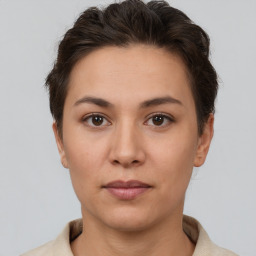 Neutral white young-adult female with short  brown hair and brown eyes