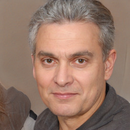 Joyful white middle-aged male with short  brown hair and brown eyes