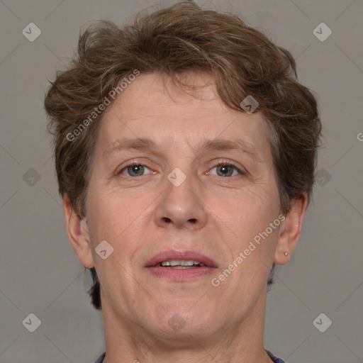 Joyful white adult male with short  brown hair and grey eyes