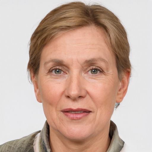 Joyful white middle-aged female with medium  brown hair and grey eyes