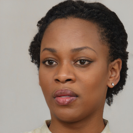Neutral black young-adult female with short  black hair and brown eyes