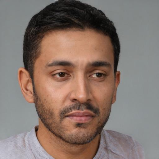 Neutral latino young-adult male with short  black hair and brown eyes