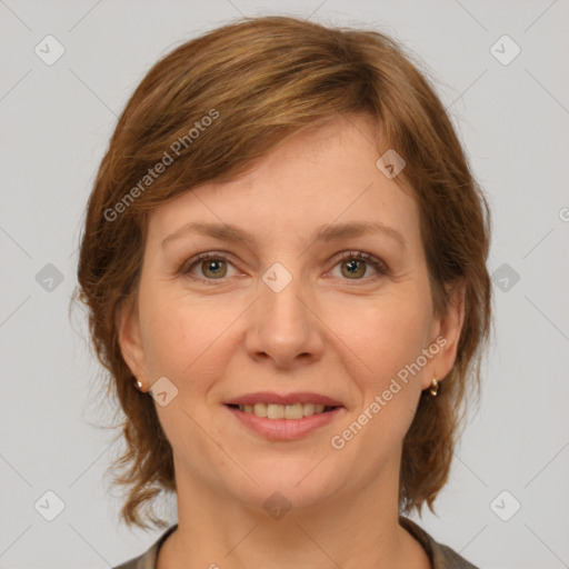 Joyful white adult female with medium  brown hair and grey eyes