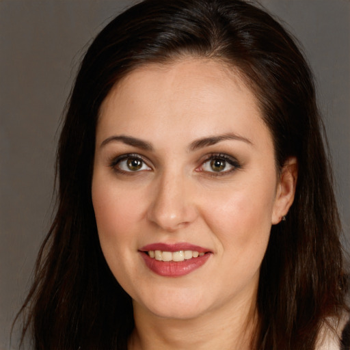 Joyful white young-adult female with long  brown hair and brown eyes