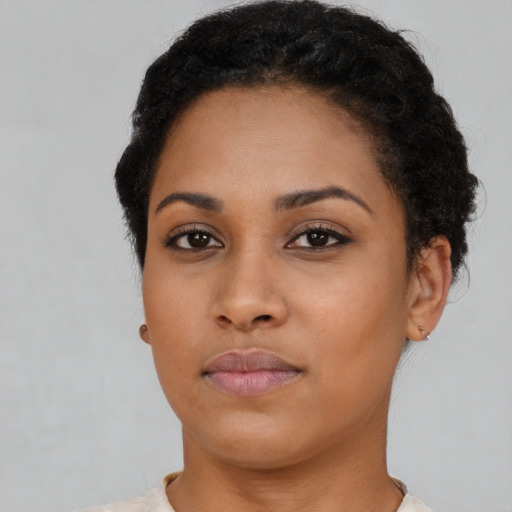 Neutral black young-adult female with short  black hair and brown eyes